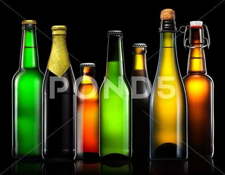 Set of beer bottles isolated on black background Stock Photos