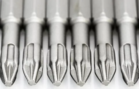 Set of bits for the screws. Selection of replaceable shapes and bits for a sc Stock Photos