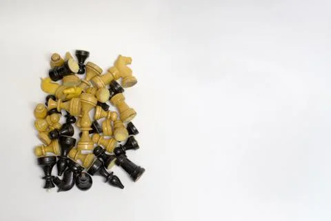 Set of blacks and whites chess pieces in a neat pile Stock Photos