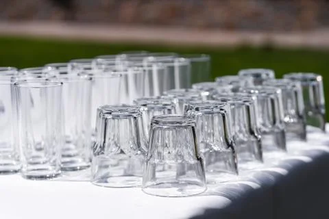 Set of blank empty wine glasses displayed in rows. Preparation for the holida Stock Photos