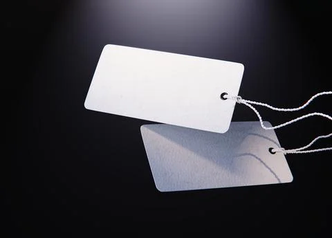 Set of blank tags tied with a string. Price tag, gift tag, sale tag. Stock Photos