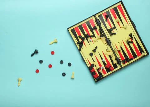 Set of board games: checkers, backgammon, chess on a blue background, top vie 写真素材