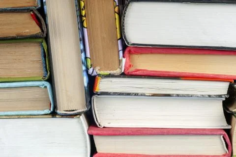 Set of books in the library. Knowledge, Science. Toned image Stock Photos