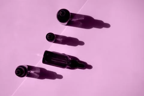Set of bottles for cosmetics on pink background Stock Photos
