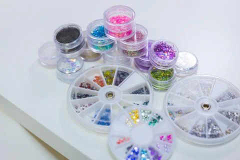Set of bright glitters in transparent jars Stock Photos