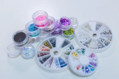 Set of bright glitters in transparent jars Stock Photos