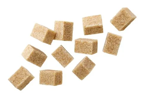 Set of brown sugar cubes flying on a white background. Isolated Stock Photos