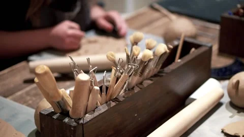 Set of brushes in ceramic workshop table. Art of clay Stock Footage 201568645