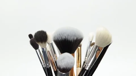 Set of brushes for makeup. Many makeup brushes rotate. Brushes close-up. Stock Footage 128784164