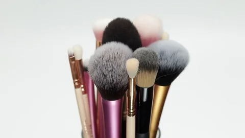 Set of brushes for makeup. Many makeup brushes rotate. Brushes close-up. Stock Footage 128784234