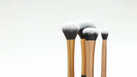 Set of brushes for makeup. Many makeup brushes rotate. Brushes close-up. Stock Footage 129137316