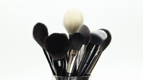 Set of brushes for makeup. Many makeup brushes rotate. Brushes close-up. Stock Footage 129137379