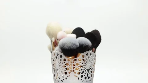 Set of brushes for makeup. Many makeup brushes rotate. Brushes close-up. Stock Footage 129137500
