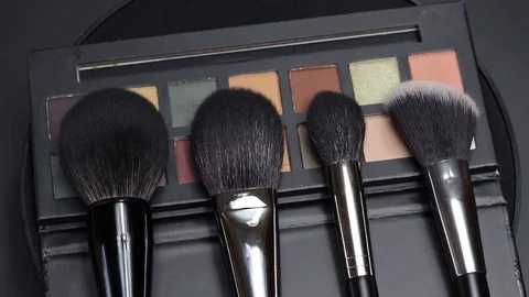 Set of brushes for makeup. Many makeup brushes rotate. Brushes close-up. Stock Footage 129137587