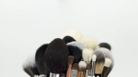 Set of brushes for makeup. Many makeup brushes rotate. Brushes close-up. Stock Footage 129137632