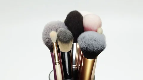 Set of brushes for makeup. Many makeup brushes rotate. Brushes close-up. Stock Footage 129137732