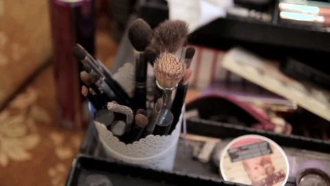 Set of brushes for makeup on table in room Stock Footage 76252654