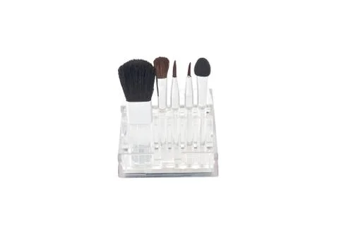 Set of brushes for makeup in a transparent box Stock Photos