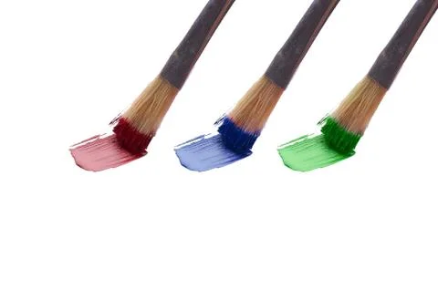 Set of brushes with paint on white background Stock Photos