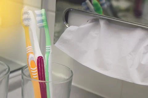 Set of brushes for teeth, teethbrushes for all family image in bathroom, in a Stock Photos