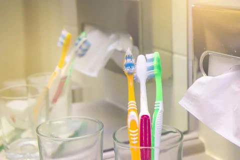 Set of brushes for teeth, teethbrushes for all family image in bathroom, in a Stock Photos
