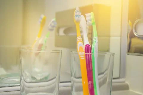 Set of brushes for teeth, teethbrushes for all family image in bathroom, in a Stock Photos
