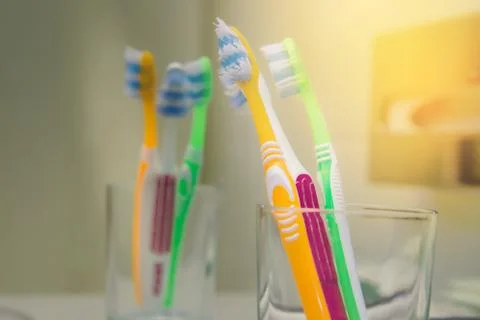 Set of brushes for teeth, teethbrushes for all family image in bathroom, in a Stock Photos