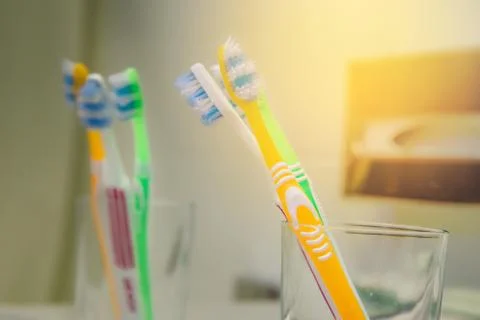 Set of brushes for teeth, teethbrushes for all family image in bathroom, in a Foto stock