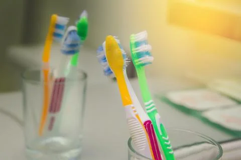 Set of brushes for teeth, teethbrushes for all family image in bathroom, in a Stock Photos