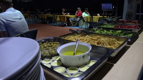 Set buffet dinner table and people onboard at the sea 2 Video stock 112605308