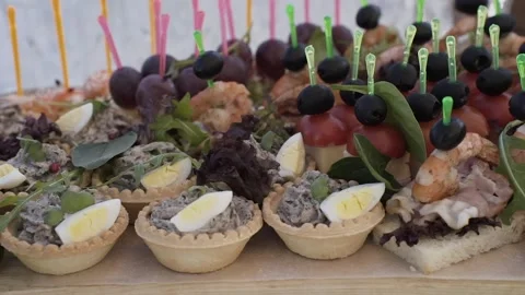 A set buffet table at a celebration, slow motion camera movement Stock Footage 328182657