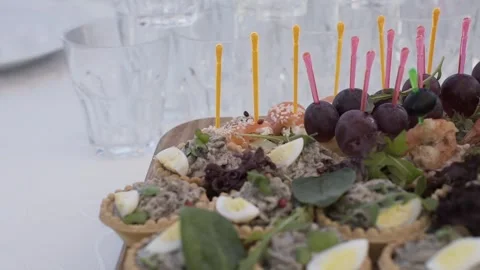 A set buffet table at a celebration, slow motion camera movement Stock Footage 328182817