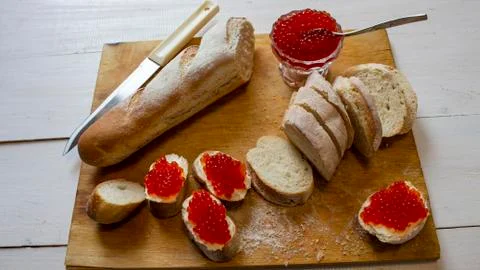 Set canapes with caviar on black background Stock Photos