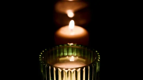 Set of candles burning with dark background. Fire Wick at black environment Stock Footage 127283800