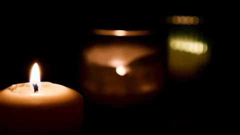 Set of candles burning with dark background. Fire Wick at black environment Stock Footage 127283867