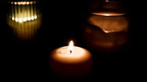 Set of candles burning with dark background. Fire Wick at black environment Stock Footage 127283891