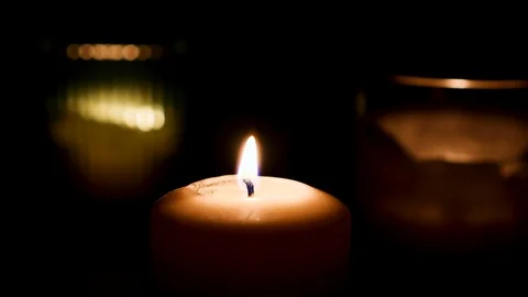 Set of candles burning with dark background. Fire Wick at black environment Stock Footage
