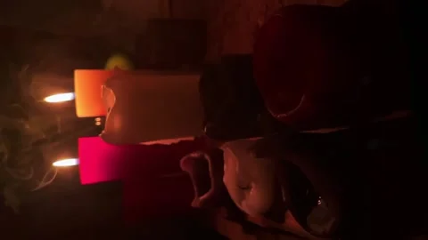 Set of candles with to of them on fire and everything surrounded with smoke Stock Footage 150226779