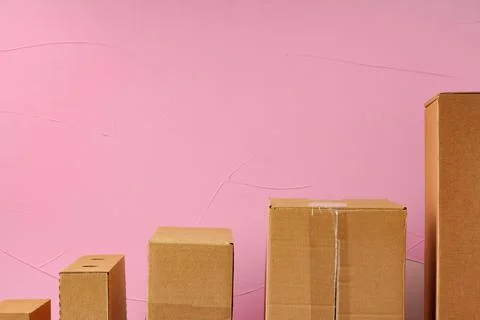 Set of cardboard boxes on pink background Stock Photos