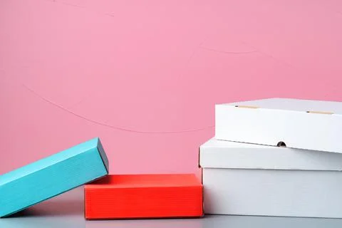 Set of cardboard boxes on pink background Stock Photos