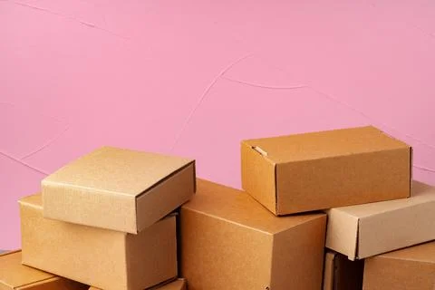 Set of cardboard boxes on pink background Stock Photos