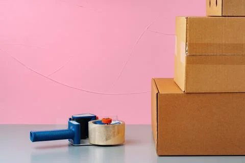 Set of cardboard boxes on pink background Stock Photos
