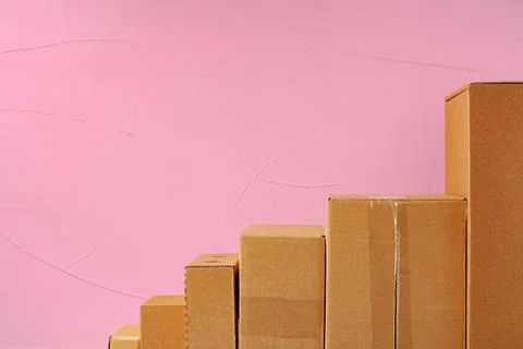 Set of cardboard boxes on pink background Stock Photos