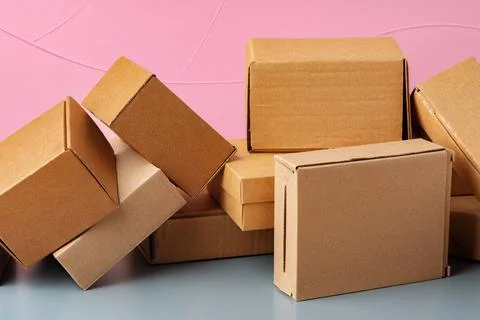 Set of cardboard boxes on pink background Stock Photos