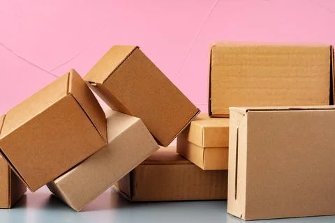 Set of cardboard boxes on pink background Stock Photos