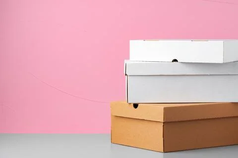 Set of cardboard boxes on pink background Stock Photos