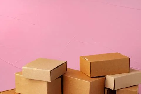 Set of cardboard boxes on pink background Stock Photos