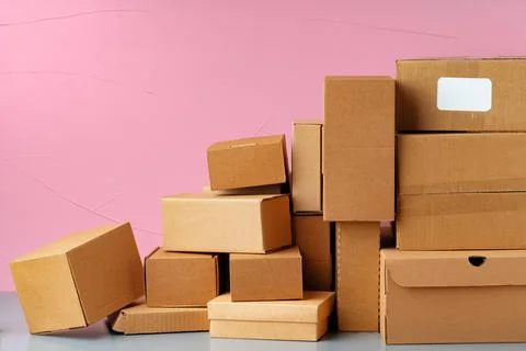 Set of cardboard boxes on pink background Stock Photos
