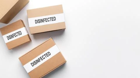 Set of cardboard boxes wait delivery, disinfected from coronavirus Stock Photos