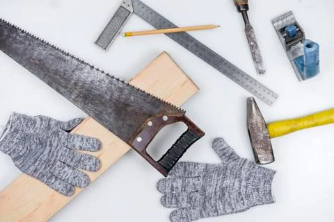 Set of carpentry tools over a white panel, top view Stock Photos